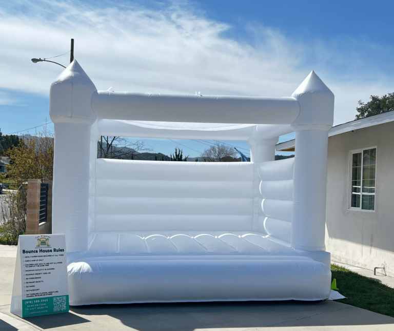 White bounce house with sun cover