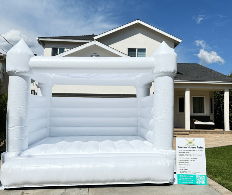 White bounce house with sun cover